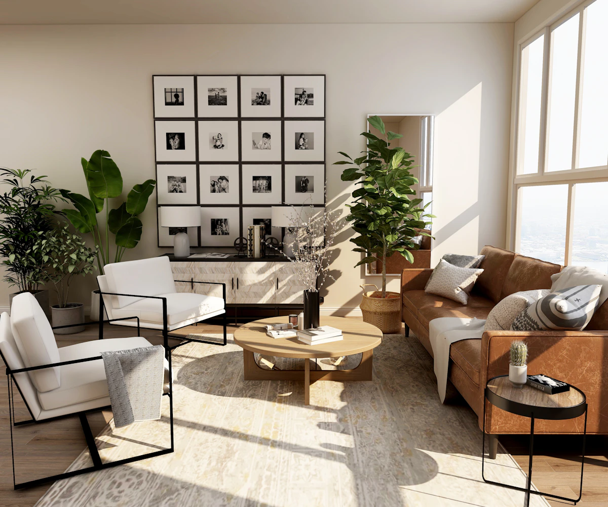 Sala de una propiedad entregada: sillones de piel, plantas y luz natural